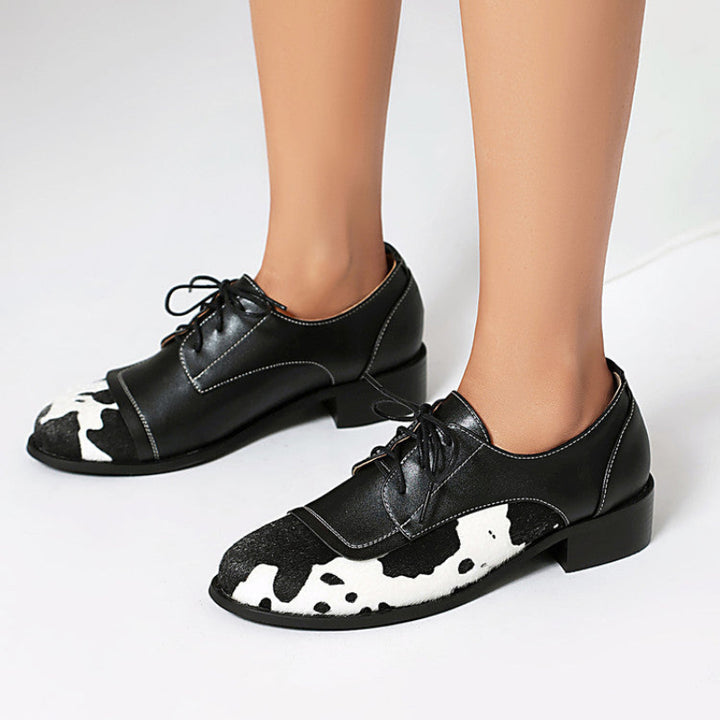 NICKI COWPRINT LOAFERS